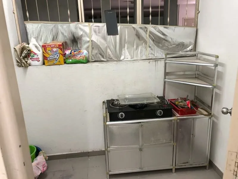 Kitchen features: metal cabinetry, stainless-steel countertop, gas stove, open shelving, grey tiled flooring, white painted walls, window with metal bars, various kitchen items on shelves.