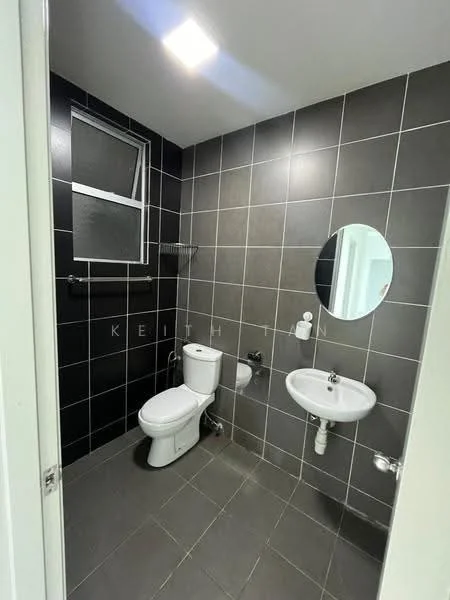Bathroom features: black tiled walls, grey tiled flooring, one-piece toilet, wall-mounted sink, round mirror, window for natural light, towel rack, chrome faucet, LED ceiling light; style: modern.