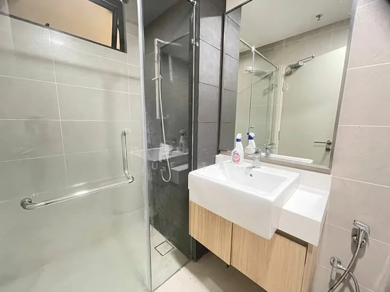 Bathroom features: glass shower enclosure, rain shower head, handheld shower, single-sink vanity with wood cabinet, white ceramic sink, chrome basin mixer, mirror with frame, tile cladding on walls, light-colored floor tiles, towel rail, toilet, shower wall with dark tiles; style: modern.