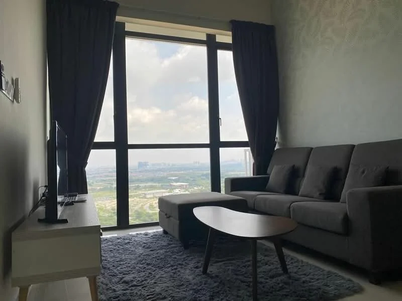 Living features: 3-seater fabric sofa in grey, coffee table, TV console, wall-mounted TV, area rug with geometric pattern, floor-to-ceiling windows, blackout curtains, light green accent wall, city view; style: modern; view: city.