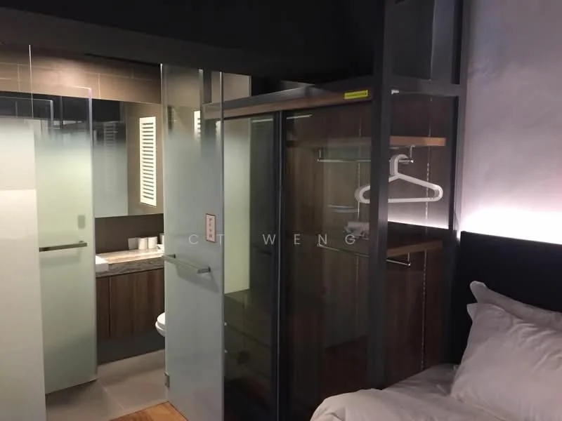 Bedroom features: queen-size bed, upholstered headboard, built-in wardrobe with glass doors, wooden shelving, hanging rod for clothes, recessed lighting, wooden flooring, neutral wall colour; style: modern. Bathroom features: vanity with sink, mirror above vanity, toilet, tile flooring, neutral wall colour.