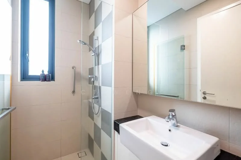 Bathroom features: walk-in shower with glass enclosure, chrome handheld shower, chrome wall-mounted showerhead, single-sink vanity with white cabinet, mirror above sink, black countertop, light grey tiled walls, dark grey tiled flooring, window with black frame, towel rail, soap dispenser, toiletries on shelf; style: modern.