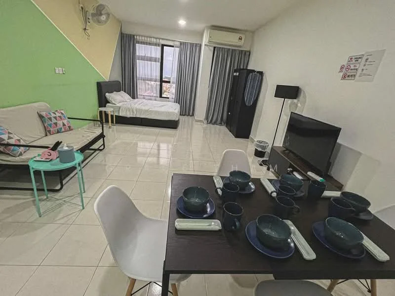 Living features: white painted walls, green accent wall, ceramic tile flooring, 5-blade ceiling fan, wall-mounted air conditioning unit, sofa bed with colorful cushions, coffee table, TV console, wall-mounted TV, dining table with 6 chairs, blue dinnerware, cutlery on the table, window with sheer curtains, curtains in grey, waste bin; style: modern; view: city. Room features: bed with white bedding, bedside lamp, wardrobe.