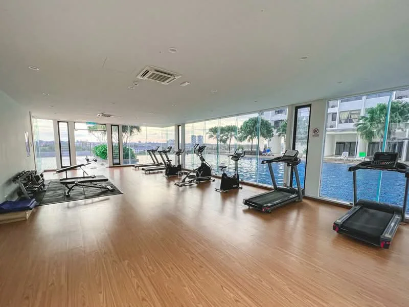Room features: large floor-to-ceiling windows, wooden flooring, treadmills, stationary bikes, weight bench, free weights, air conditioning unit, mirrored wall, view of swimming pool, palm trees visible outside; style: modern; view: pool.