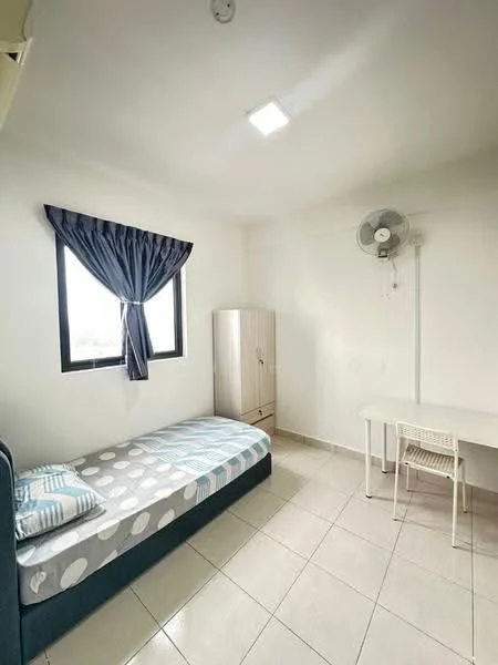 Bedroom features: single bed with blue and white bedding, white walls, tiled flooring, window with sheer curtains, ceiling light fixture, wall-mounted ceiling fan, built-in wardrobe with light wood finish, study desk with white chair; style: minimalist.