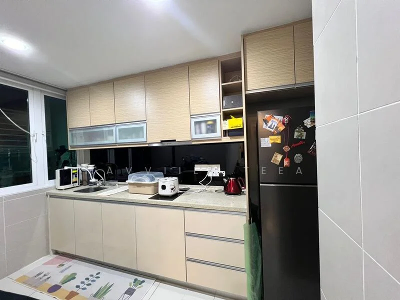Kitchen features: light wood cabinetry, black countertop, double-bowl stainless-steel sink, chrome pull-down faucet, built-in oven, stainless-steel fridge, microwave, kettle, toaster, decorative magnets on fridge, window with sheer curtains, tile flooring, wall-mounted cabinets, black backsplash; style: modern.