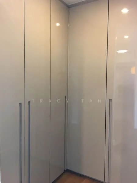 Room features: built-in wardrobe, high-gloss cabinet doors, sliding doors, modern design, recessed lighting, wooden flooring; style: modern.