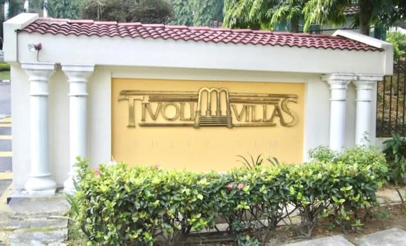 Exterior features: decorative entrance sign, yellow painted wall, white columns, red tiled roof, landscaped greenery, bushes in front of sign; style: modern.