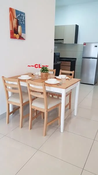 Dining features: wooden dining table with white legs, 4 wooden dining chairs, ceramic plates on the table, glass drinking glasses, small potted plant as centerpiece, framed artwork on the wall, light-colored walls, tile flooring, refrigerator visible in the background, kitchen cabinetry visible in the background; style: modern.