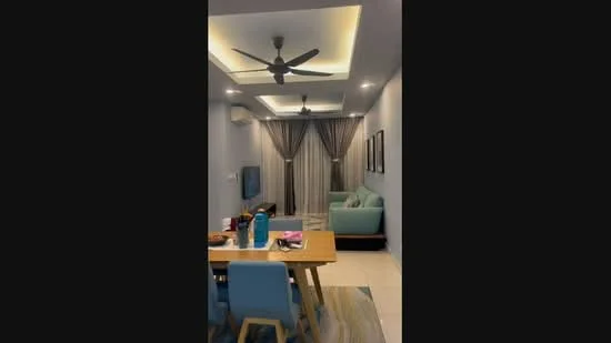 Living features: 5-blade ceiling fan with light, recessed downlights, grey painted walls, cream ceiling with cove lighting, floor-to-ceiling curtains, light green fabric sofa, wooden dining table, 4 blue dining chairs, wall-mounted TV, area rug with geometric pattern, decorative wall art; style: modern.