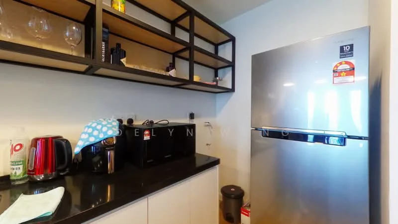 Kitchen features: black granite countertop, stainless-steel fridge, microwave, black countertop appliances, open shelving, white cabinetry, kitchen towels, glassware on shelves, kitchen trash bin; style: modern.