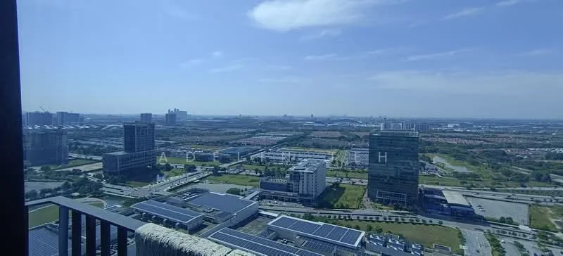 Exterior type: high-rise condominium; features: city skyline view, solar panels on rooftops, surrounding urban landscape, green spaces, multiple buildings in view, clear blue sky; style: modern.