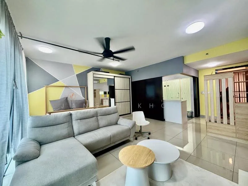 Living features: L-shape sectional sofa in light grey fabric, round wooden coffee table, white accent chair, ceiling fan with light, recessed LED downlights, large windows with sheer curtains, glossy tile flooring, decorative wall with geometric patterns in grey and yellow, open layout to kitchen area, wall-mounted TV, decorative shelving unit; style: modern. Room features: partition wall with wooden slats, kitchen area visible in background, light-colored cabinetry, open space layout.