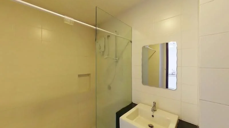 Bathroom features: glass shower enclosure, wall-mounted shower head, built-in shower niche, white tiled walls, cream tiled walls, mirror above sink, single-bowl sink, chrome faucet, dark countertop, light-colored grout, recessed lighting; style: modern.