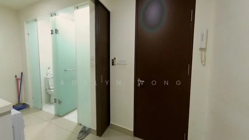Room features: white walls, light-colored floor tiles, wooden door, frosted glass door, toilet visible, clean and modern design, wall-mounted intercom, broom visible; style: modern.