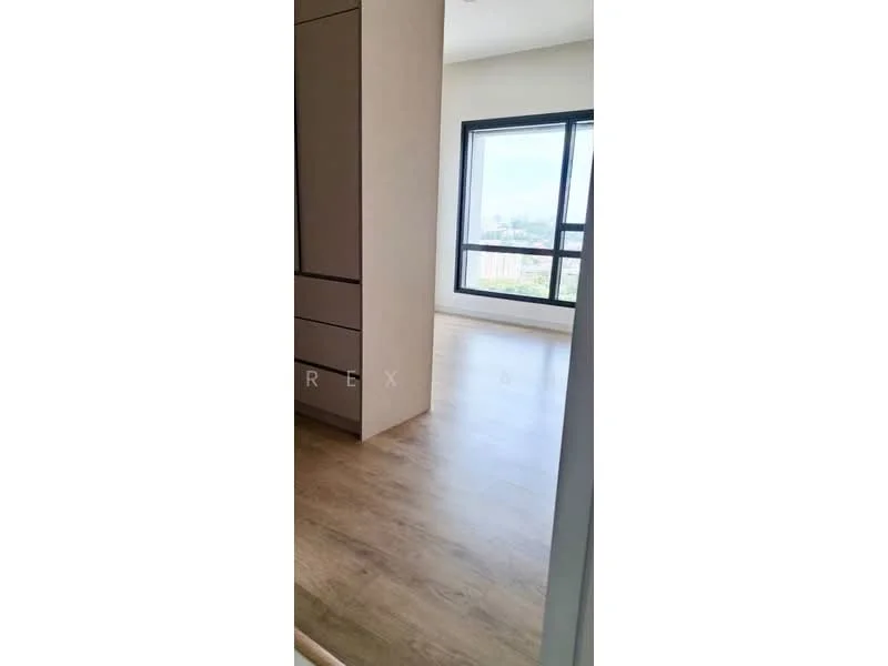 Room features: light wood laminate flooring, large window with city view, neutral painted walls, built-in cabinetry, natural light, minimalist design; style: modern; view: city.