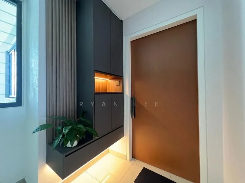 Room features: dark cabinetry with vertical slats, built-in storage unit, warm LED lighting under cabinetry, brown wooden door, light-colored floor tiles, green potted plant, white painted walls, window with natural light; style: modern.