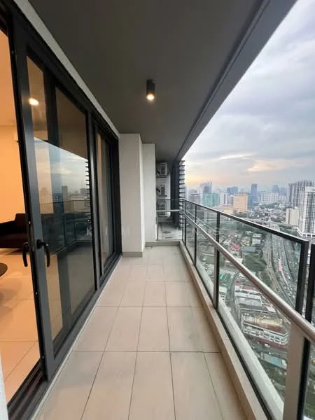 Room features: balcony, glass sliding doors, grey tiled flooring, metal railing, city skyline view, overcast sky; style: modern; view: city.