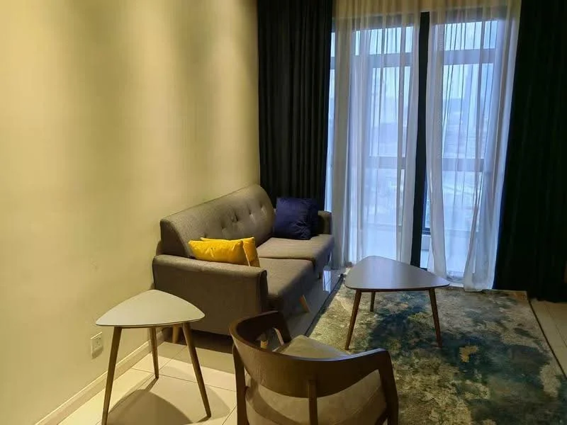 Living features: grey fabric sofa, yellow accent pillow, two modern coffee tables, area rug with abstract pattern, floor-to-ceiling windows, sheer curtains, dark green curtains, wall with light paint, tile flooring; style: modern.