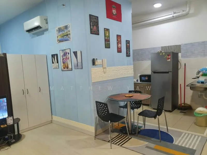 Kitchen features: light blue painted walls, cream tiled backsplash, ceramic tile flooring, refrigerator, stainless-steel sink, kitchen countertop, wall-mounted air conditioning unit, dining table with four chairs, wall-mounted artwork, cooking stove, cabinets, cleaning supplies visible; style: modern.