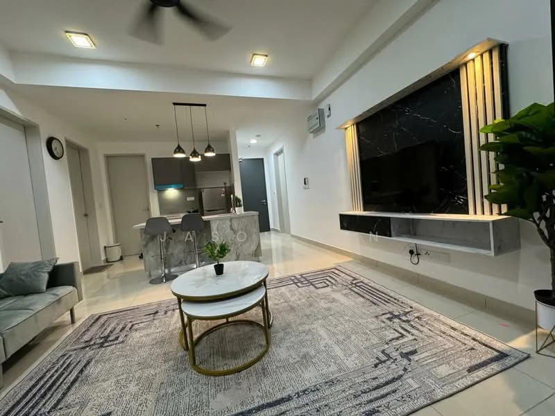Living features: grey fabric sofa, round coffee table with gold frame, area rug with geometric pattern, wall-mounted TV, black marble feature wall, recessed downlights, ceiling fan, potted plant, open kitchen view, tile flooring, wall clock; style: modern. Kitchen features: kitchen island with grey countertop, stainless-steel appliances, open layout, bar stools; style: modern.