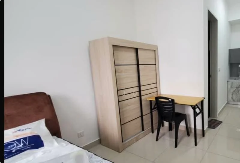 Bedroom features: queen-size bed with white bedding, wooden wardrobe with sliding doors, small study desk with black chair, cream tiled flooring, white painted walls, recessed lighting, window with no visible treatment, neutral decor; style: modern.