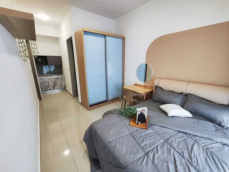 Bedroom features: queen-size bed with upholstered headboard, grey bedding, wooden bedside table, framed mirror, tile flooring, white painted walls, accent wall in beige, built-in wardrobe with sliding doors, decorative plant on bedside table, small photo frame on bedside table, refrigerator visible in background; style: modern.