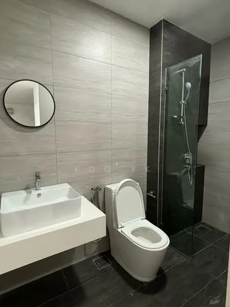 Bathroom features: grey tile walls, black tile flooring, round mirror, single-bowl sink, chrome faucet, wall-mounted toilet, walk-in shower with glass enclosure, rain shower head, handheld shower, glass shower panel; style: modern.