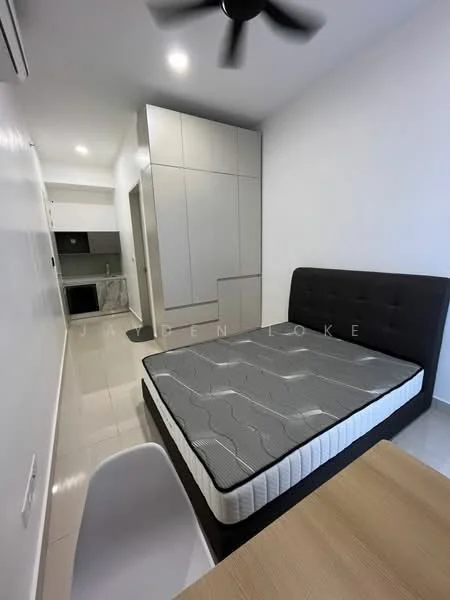 Bedroom features: queen-size bed with grey mattress, black upholstered headboard, white walls, recessed downlights, 5-blade ceiling fan, built-in wardrobe with sliding doors, tile flooring, window with sheer curtains, study desk, white dining chair; style: modern. Kitchen features: kitchen cabinetry with grey finish, marble countertop, built-in appliances, tile backsplash, open layout to bedroom; style: modern.
