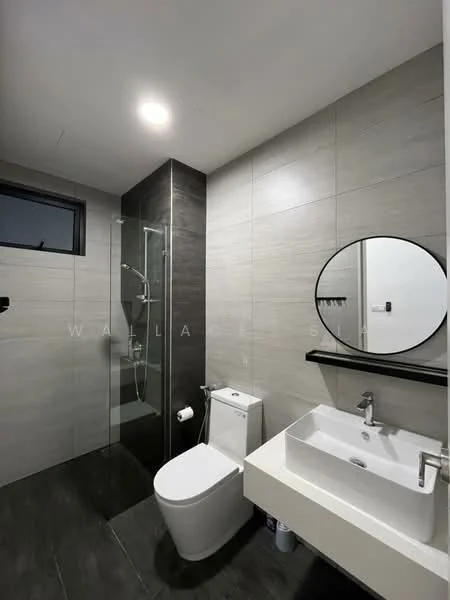 Bathroom features: grey tiled walls, black accent wall, glass shower enclosure, rain shower head, handheld shower, single-sink vanity with white cabinet, round mirror, one-piece toilet, recessed ceiling lights, dark tiled flooring; style: modern.