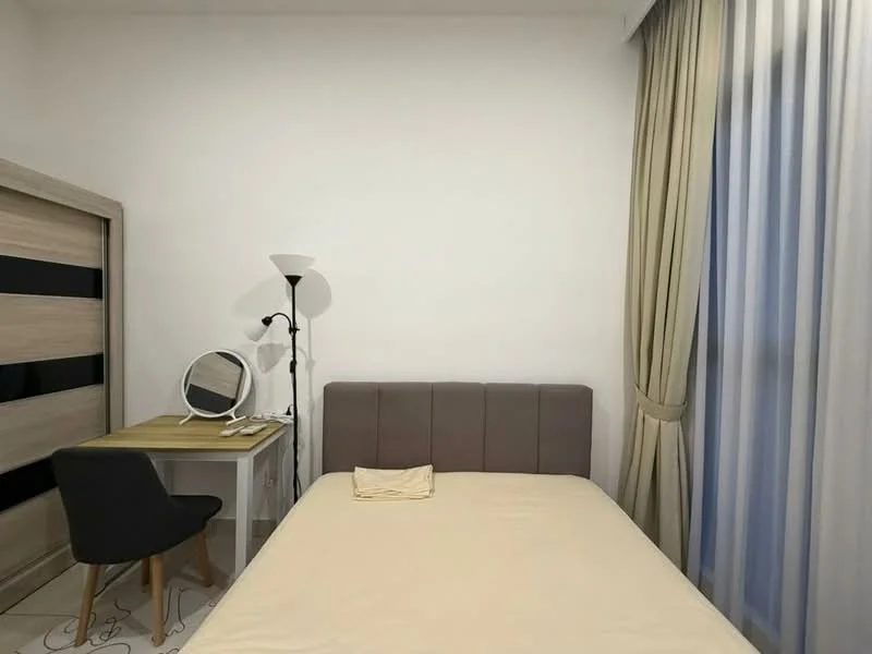 Bedroom features: queen-size bed with upholstered headboard, light beige bedspread, wooden desk with drawer, black chair with wooden legs, full-length mirror on desk, floor lamp with white shade, curtains in light beige, white painted walls, tile flooring with decorative pattern, built-in wardrobe with sliding doors; style: modern.