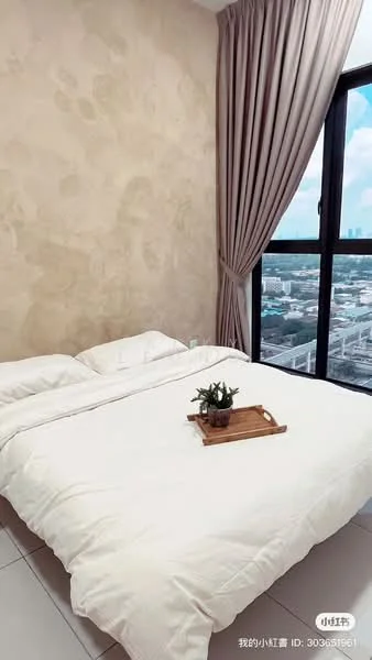 Bedroom features: king-size bed with white bedding, decorative throw pillow, wooden tray on bed, curtains in light beige, floor-to-ceiling window, city view from window, cream textured wall, white tiled flooring, small potted plant on tray; style: modern; view: city.