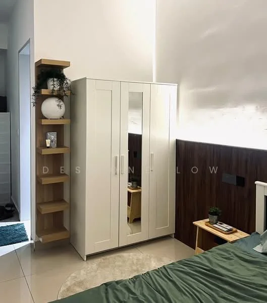 Room features: white wardrobe with mirrored doors, wooden shelving unit, green area rug, bed with green bedding, wood panel accent wall, decorative plants on shelves, wall-mounted light fixture, neutral tile flooring; style: modern.