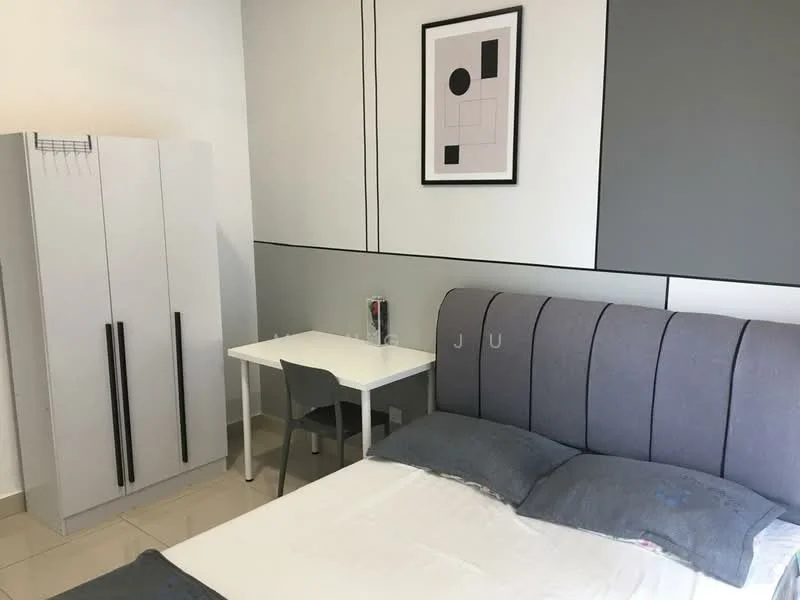 Bedroom features: queen-size bed with grey upholstered headboard, two grey pillows, white bedding, white walls, grey accent wall, white bedside table, framed artwork on wall, light-colored floor tiles, built-in wardrobe with two black handles, small study desk with chair; style: modern.
