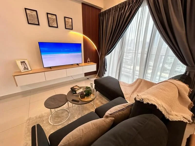 Living features: 3-seater fabric sofa in black, coffee table with round top, area rug with neutral color, wall-mounted TV, TV console with wooden finish, floor-to-ceiling windows, sheer curtains, decorative throw blanket, decorative wall art in frames, LED floor lamp, light-colored tiled flooring; style: modern; view: city.