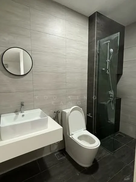 Bathroom features: grey tiled walls, black tiled flooring, round mirror, wall-mounted sink, single-bowl sink, chrome basin mixer faucet, one-piece toilet, walk-in shower with glass enclosure, rain shower head, handheld shower, glass shower panel; style: modern.