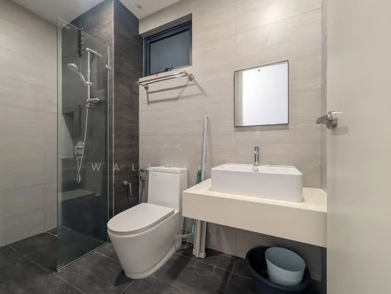 Bathroom features: walk-in shower with glass enclosure, rain shower head, handheld shower, single-sink vanity with white cabinet, square ceramic sink, chrome basin mixer, one-piece toilet, framed mirror, grey tiled walls, dark grey tiled flooring, window for natural light, shelf above toilet; style: modern.