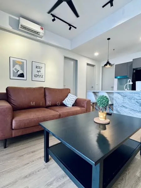 Living features: 3-seater leather sofa in brown, coffee table with black surface, wall-mounted split AC, recessed LED downlights, light wood flooring, framed artwork on walls, kitchen island with marble countertop, open layout to kitchen, decorative plant on table; style: modern.