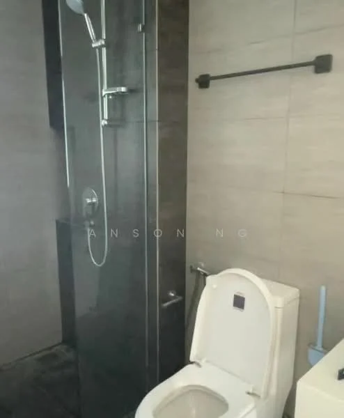 Bathroom features: walk-in shower with glass enclosure, rain shower head, handheld shower, one-piece toilet, grey tile cladding, black towel rail, white wall-mounted sink, chrome basin mixer; style: modern.