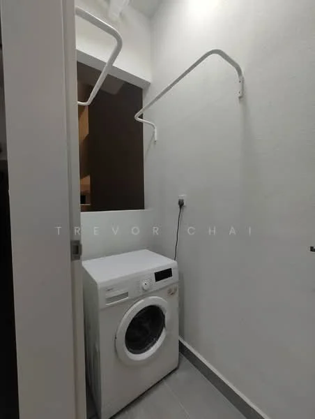 Laundry features: front-load washing machine, white appliance, grey tile flooring, white painted walls, wall-mounted drying rack, power outlet, minimalist design; style: modern.