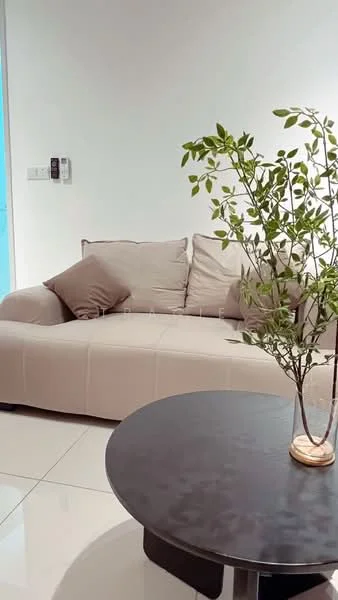 Living features: beige fabric sofa, decorative throw pillows, round black coffee table, ceramic vase with plant, glossy tile flooring, white painted walls, floor-to-ceiling windows, natural light; style: modern.