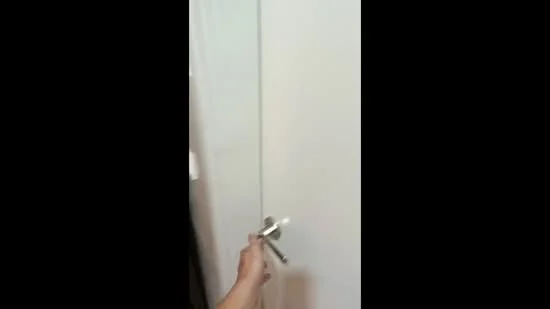 Room features: white painted walls, glass door, metal door handle.
