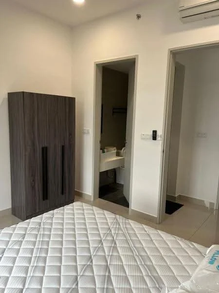Bedroom features: queen-size bed with mattress, wooden wardrobe with two doors, light-colored walls, tile flooring, wall-mounted air conditioning unit, doorway leading to bathroom, doorway leading to hallway, neutral decor; style: modern.