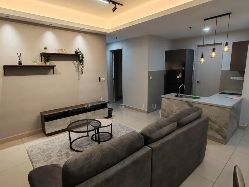 Living features: grey fabric sofa, coffee table with black frame, area rug with geometric pattern, wall-mounted shelf, decorative plants on shelf, recessed lighting, pendant lights, cream painted walls, tile flooring, open kitchen view, kitchen island with countertop, stainless-steel sink, chrome pull-down faucet, built-in kitchen cabinetry; style: modern. Kitchen features: stainless-steel sink, chrome pull-down faucet, built-in kitchen cabinetry, kitchen island with countertop, tile flooring; style: modern.
