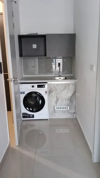 Laundry features: white cabinetry, grey upper cabinets, single-bowl stainless-steel sink, chrome pull-down faucet, front-load washing machine, marble countertop, glossy tile flooring, white painted walls; style: modern.