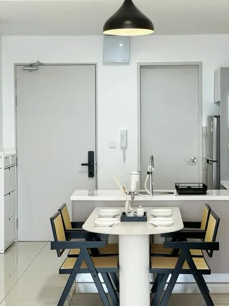 Dining features: white dining table, 4 black and yellow dining chairs, pendant light fixture, grey cabinetry, stainless-steel fridge, white walls, glossy tile flooring, built-in cabinetry, kitchen sink, kitchen countertop; style: modern. Room features: grey door, white walls, light switch, intercom panel.