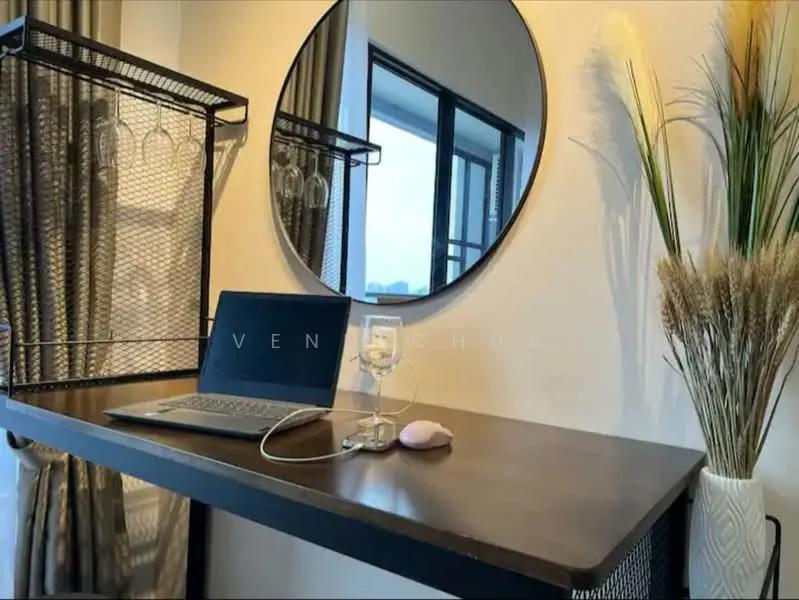 Room features: round mirror, metal shelving unit, wooden table, laptop on table, glass of water, decorative plant, curtains, city view through window; style: modern; view: city.