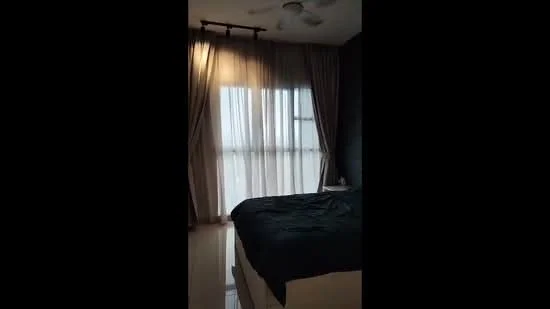 Bedroom features: king-size bed with dark bedding, floor-to-ceiling windows, sheer curtains, dark accent wall, light-colored tile flooring, ceiling fan, nightstand, decorative wall light; style: modern; view: city.