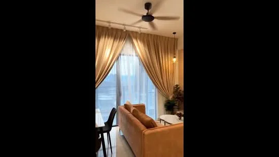 Living features: 3-seater fabric sofa in beige, ceiling fan, floor-to-ceiling windows, sheer curtains, heavy drapes, coffee table, decorative plant, area rug, wall-mounted lighting; style: modern; view: city.