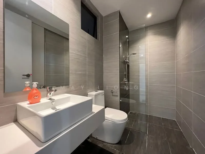 Bathroom features: grey tiled walls, dark grey tiled flooring, single-sink vanity with white cabinet, square white ceramic sink, chrome basin mixer faucet, framed mirror above sink, one-piece toilet, walk-in shower with glass enclosure, rain shower head, handheld shower, recessed downlights; style: modern.